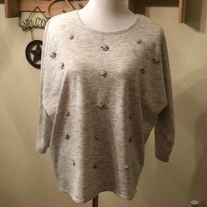 Jeweled front light sweatshirt.